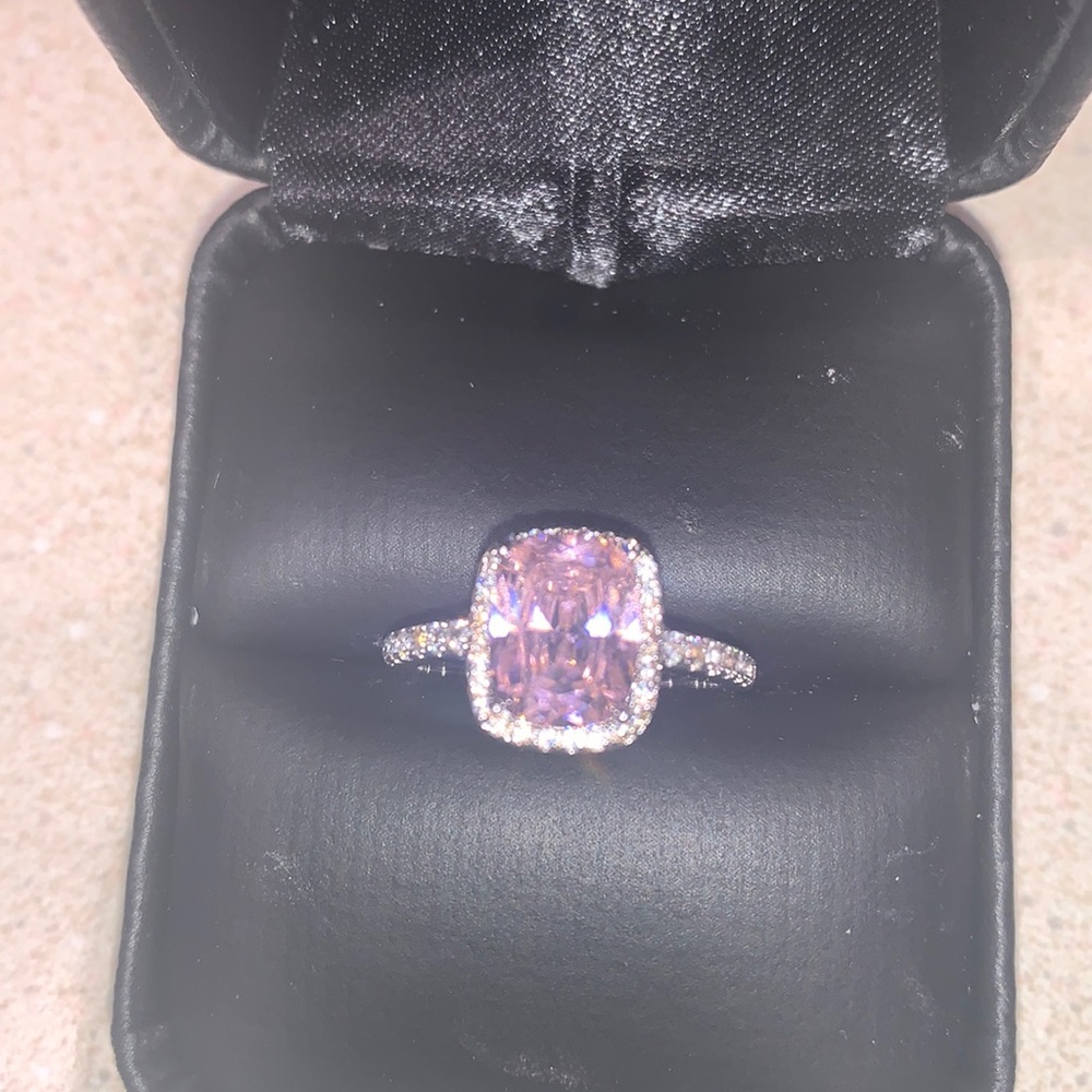 Pink quartz ring in silver.  Size 5.  CZ surrounding ring.